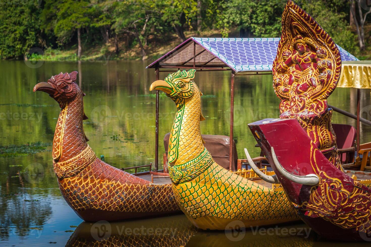 Thai traditional  boats on the lake near,Bayon temple in Angkor Thom, Siemreap, Cambodia. photo