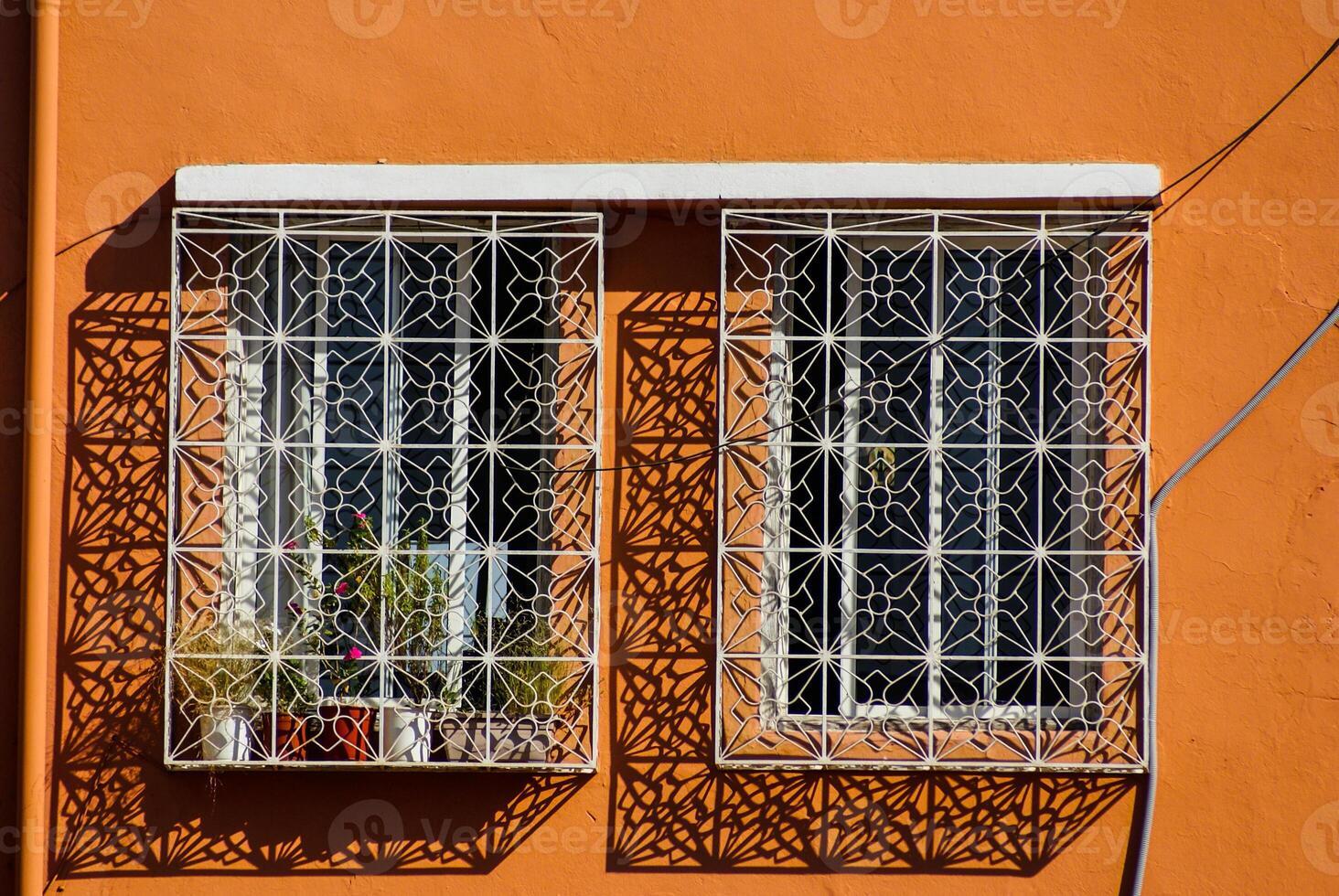 Morocco Ouarzazate - Arabesque window in the medieval Kasbah built in adobe photo