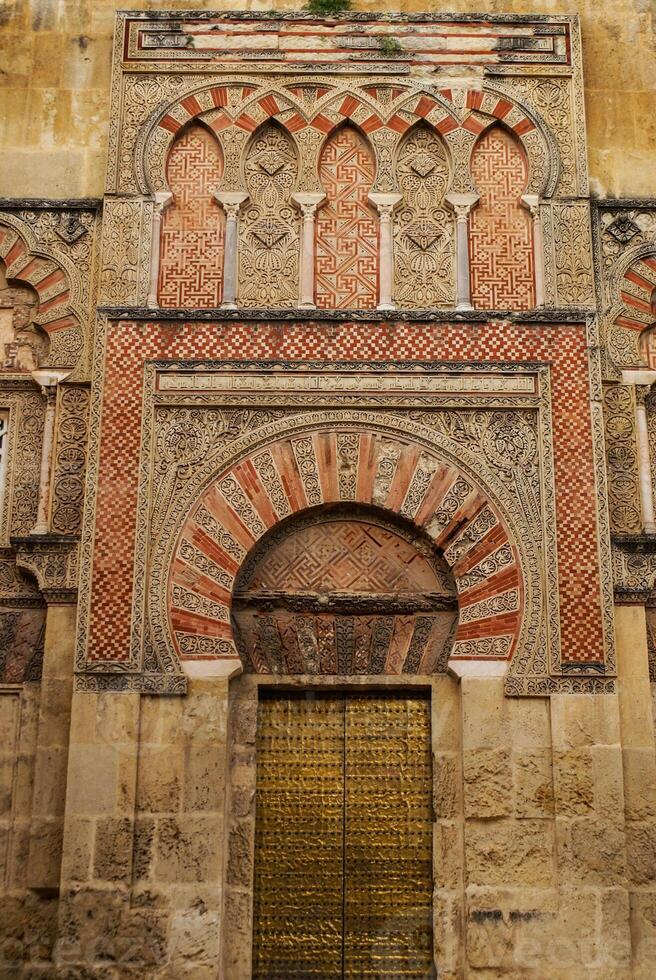 Detail of the decoration of one of the many doors that can be found in the mosque of Cordoba - Spain photo
