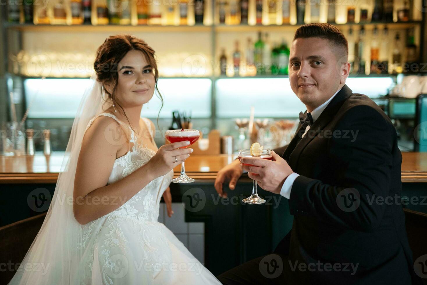 bride and groom inside a cocktail bar photo