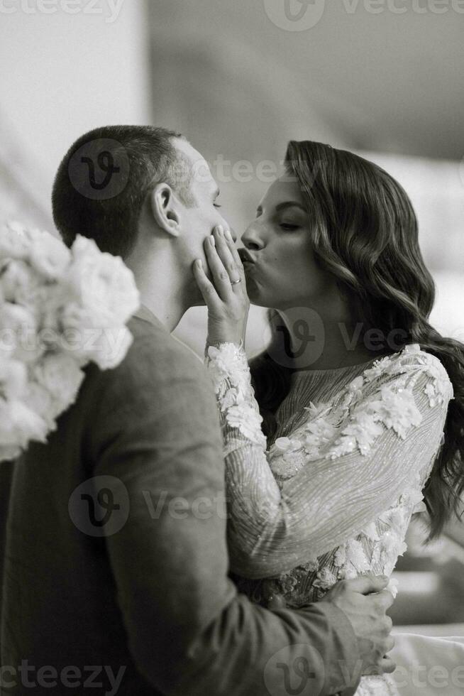 meeting of the bride and groom on the hotel stairs photo