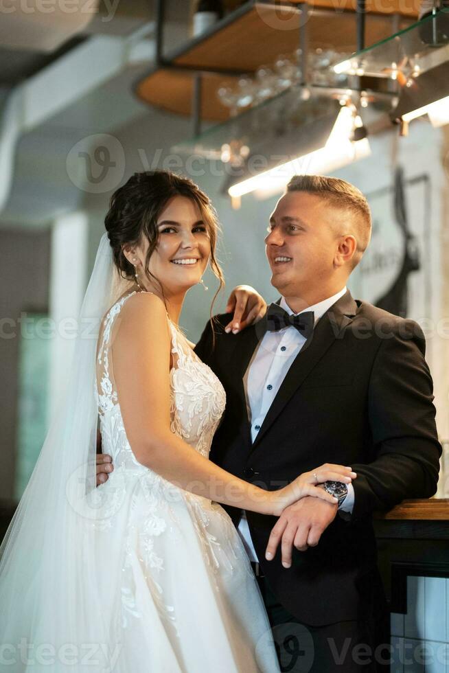 bride and groom inside a cocktail bar photo