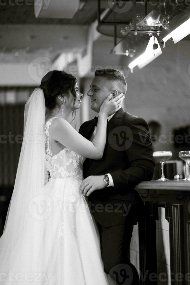 bride and groom inside a cocktail bar photo