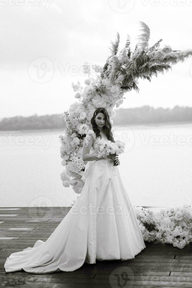 bride against the background of a yellow sunset photo