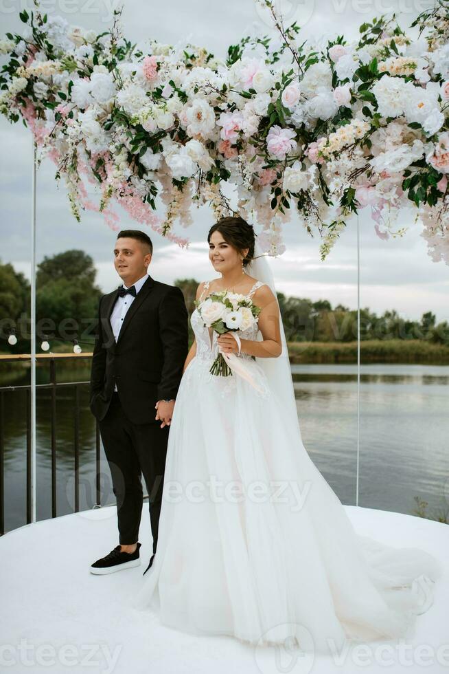 wedding ceremony of the newlyweds on the pier photo