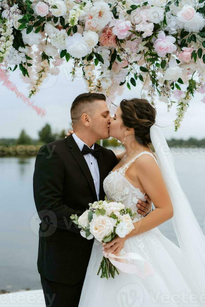 wedding ceremony of the newlyweds on the pier photo