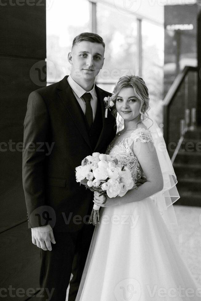 meeting of the bride and groom in the hotel lobby photo