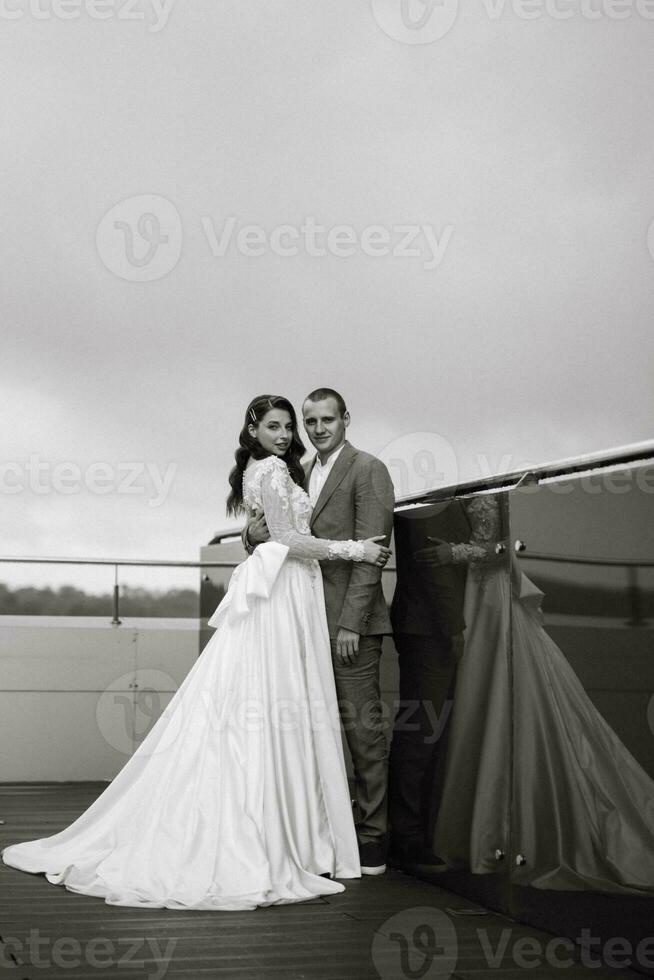 bride and groom first meeting on the roof of skyscraper photo