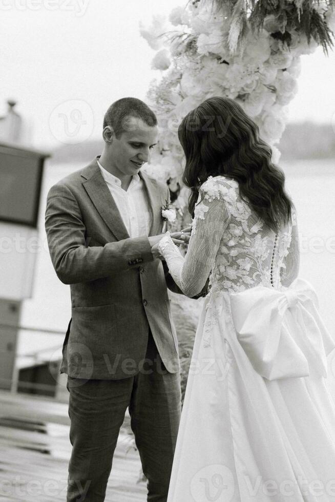 wedding ceremony of the newlyweds on the pier photo