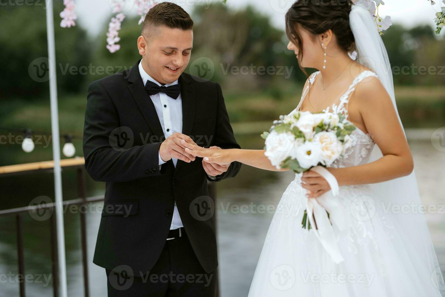 wedding ceremony of the newlyweds on the pier photo