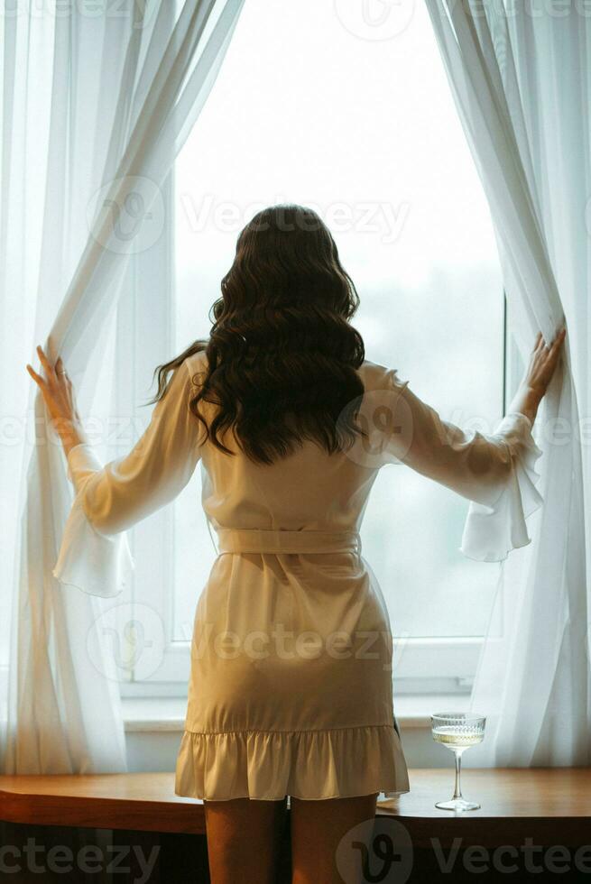 the bride gets ready in the morning in her room photo