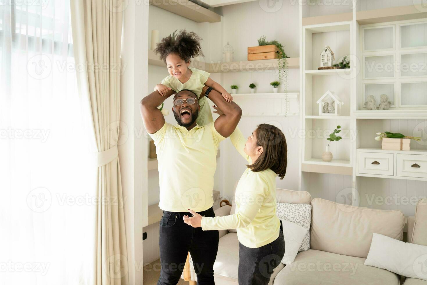 Happy Family Of Three With Little Daughter Having Fun Together At Home, Happy black family Weekend. photo