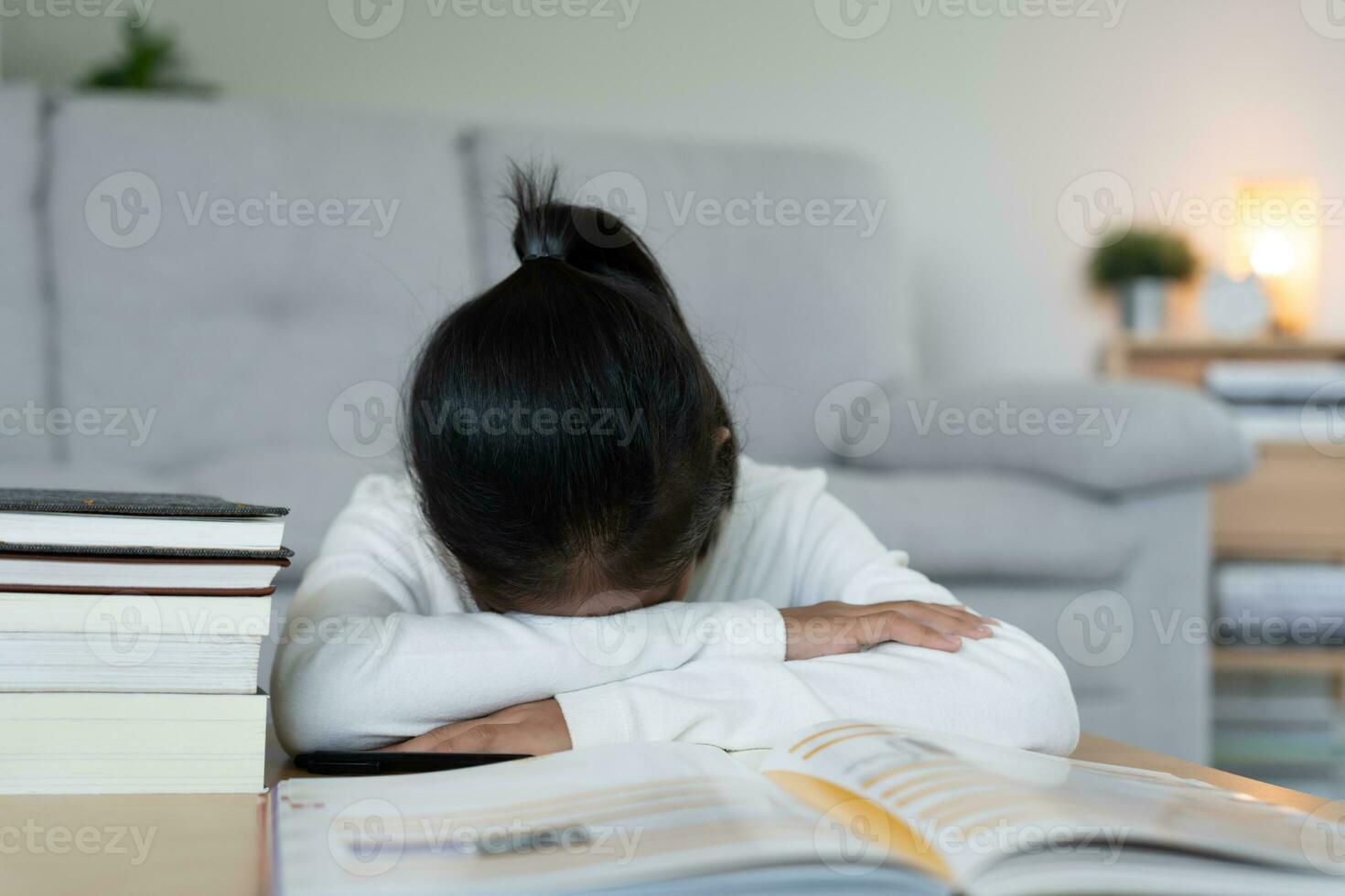 student woman have anxiety because of exams, female prepare for test and learning lessons in the library. stress, despair, haste, misunderstanding reading, discouraged, expectation, knowledge photo