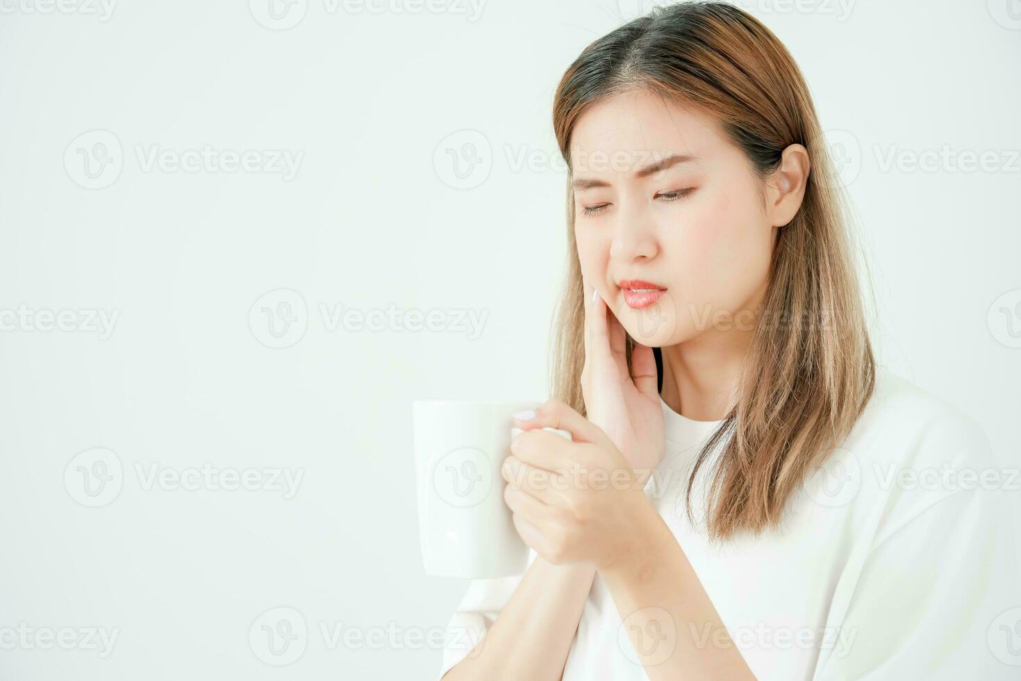 Asian woman feel sensitive teeth after drinking hot, female suffer tooth, decay problems, dental care, tooth extraction, decay problem, bad breath, Gingival Recession, Oral Hygiene instruction photo