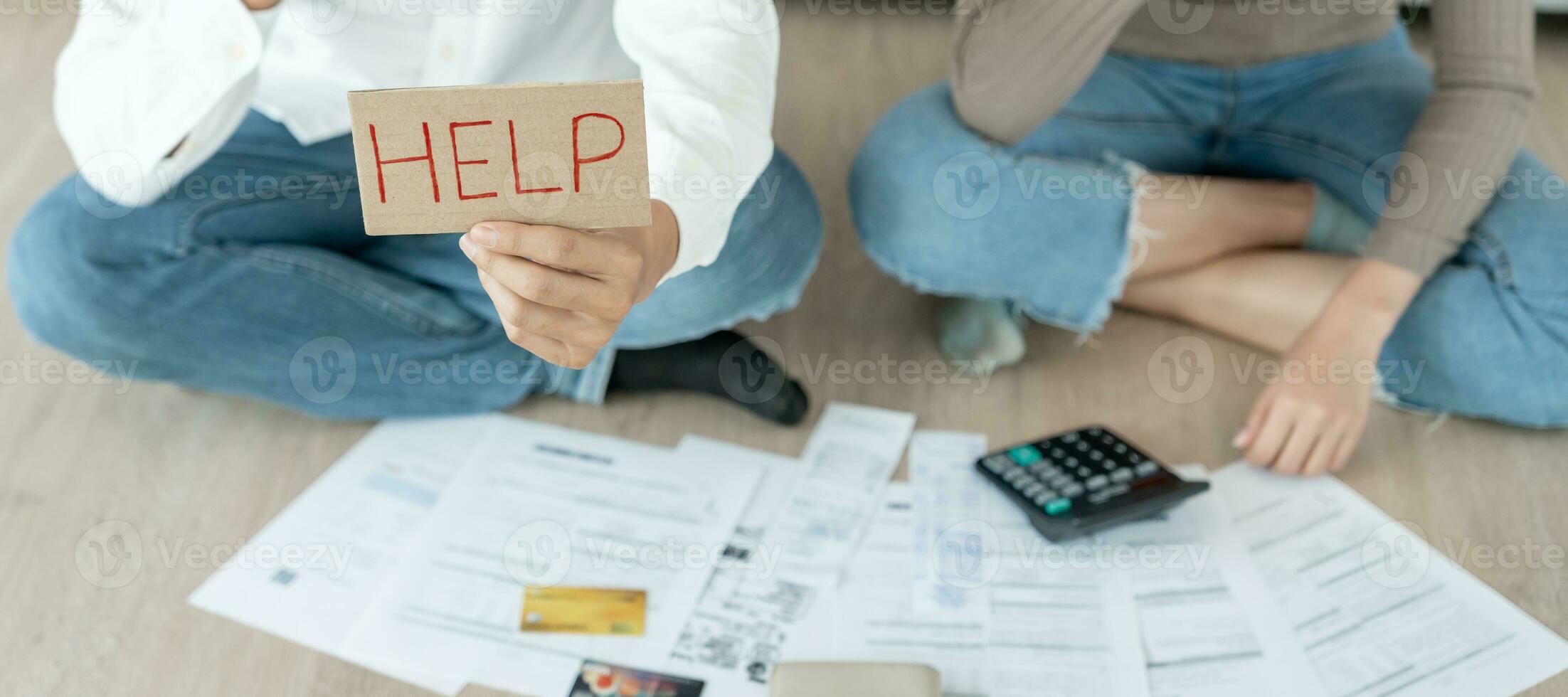 Stressed and headache asian couple with large bills or invoices no money to pay to expenses and credit card debt. shortage, Financial problems, mortgage, loan, bankruptcy, bankrupt, poor, empty wallet photo