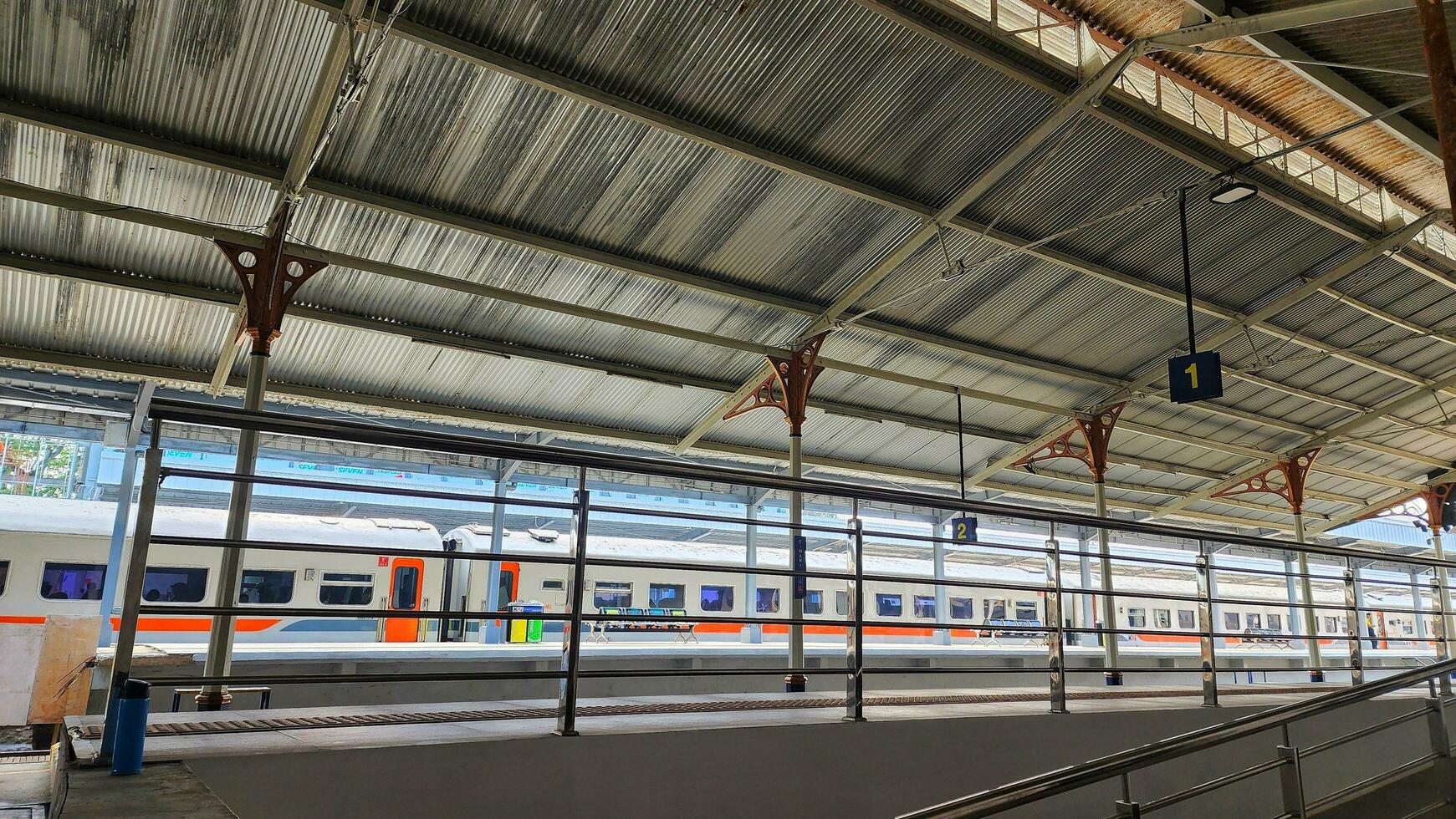 Cimahi, Indonesia. 24 December 2023. a train is parked at a train station photo