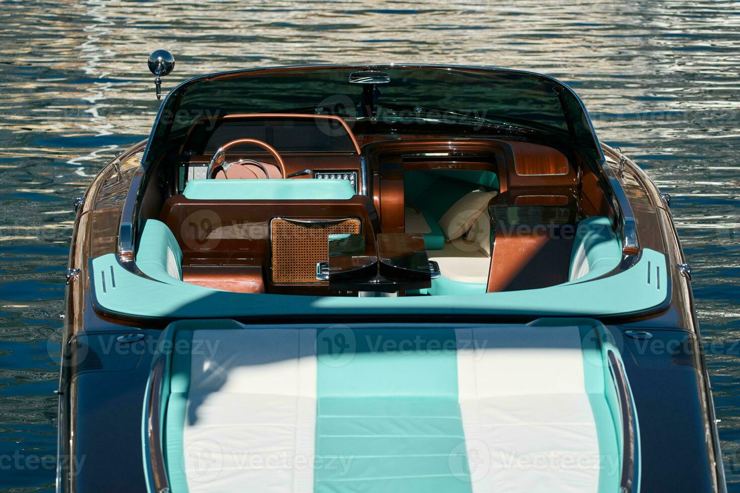 Interior of the luxury motor boat, port of Hercules in Monaco, sunny glare of the sun on the water, powerful boat, glossy surfaces shine in sunny weather photo