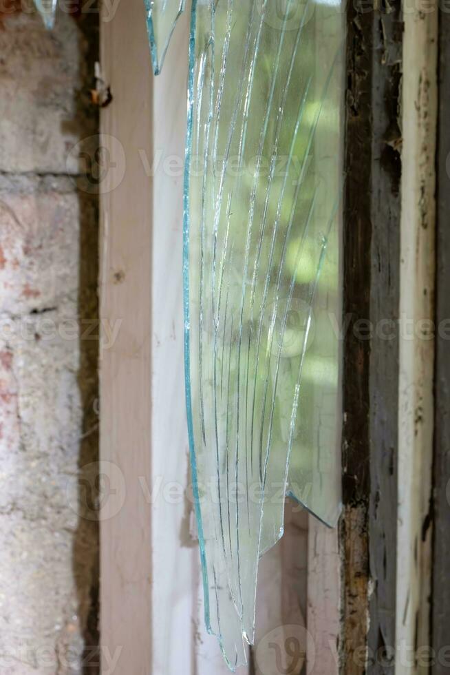 broken glass at a old destroyed window photo