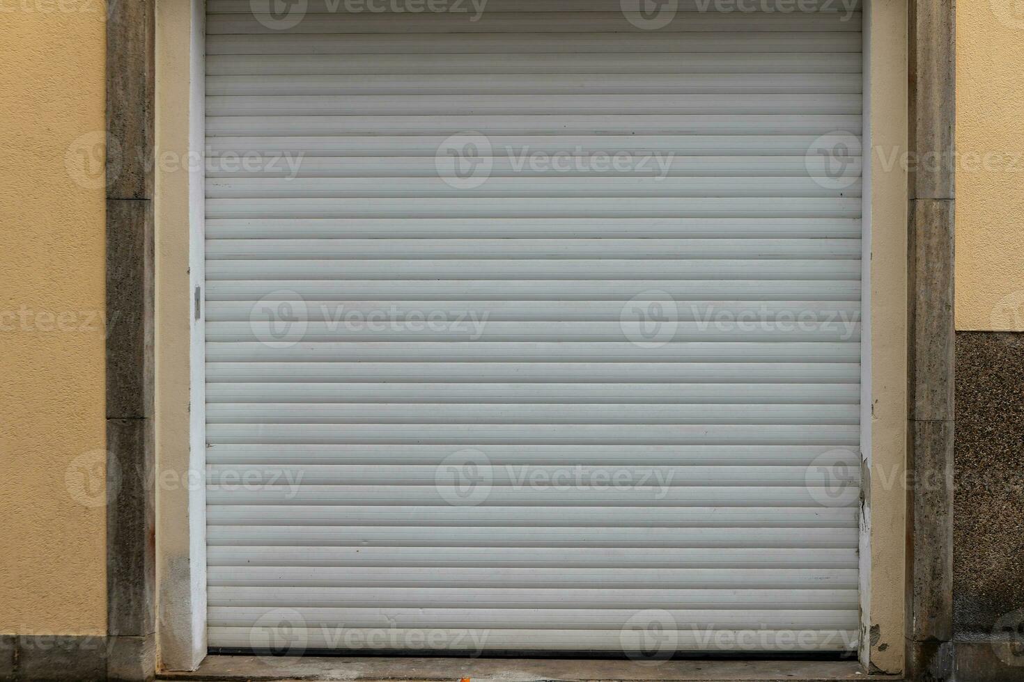 closed garage door with roller shutter photo