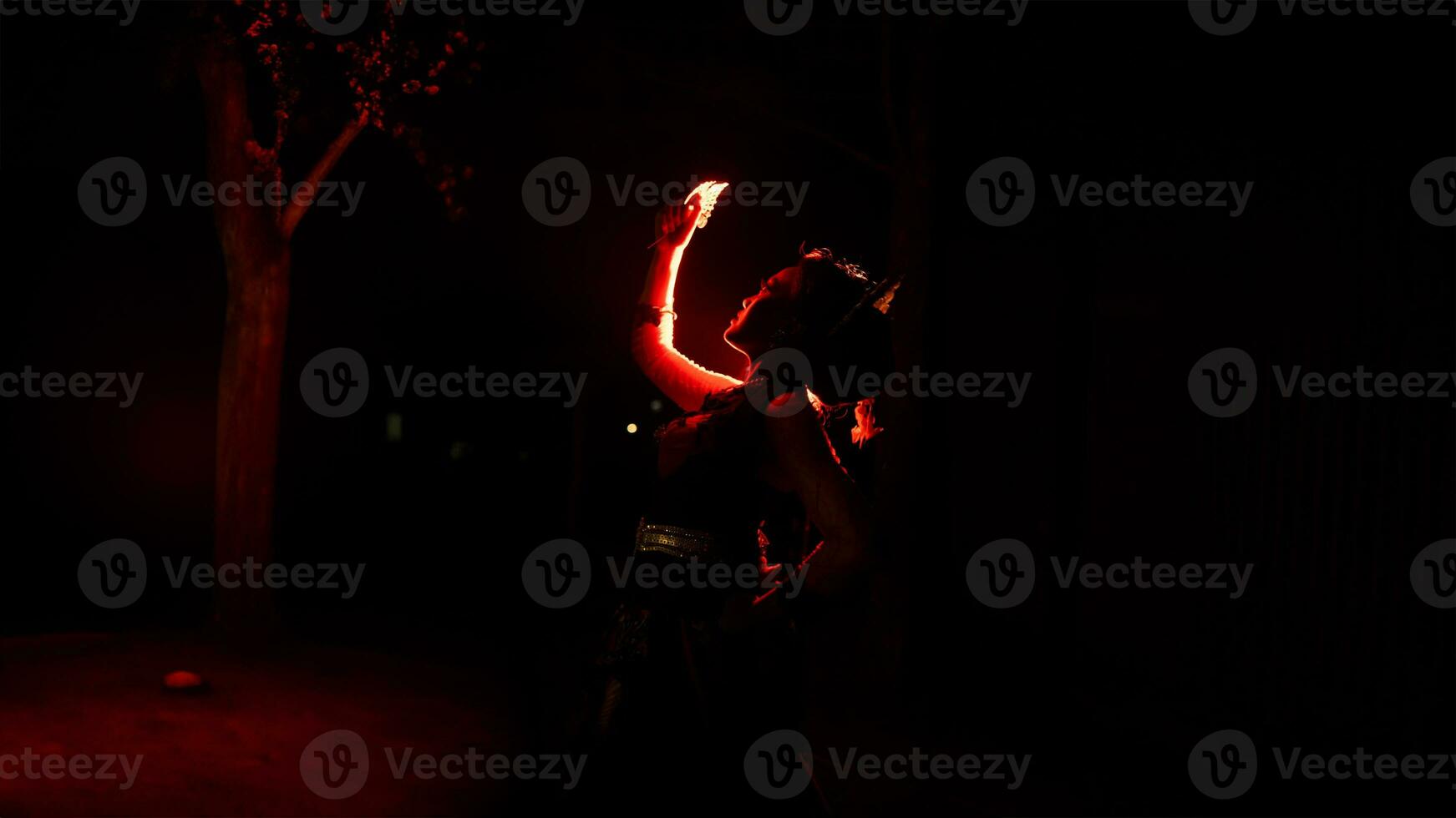 a woman holding gold jewelry with trembling hands and full of worries photo