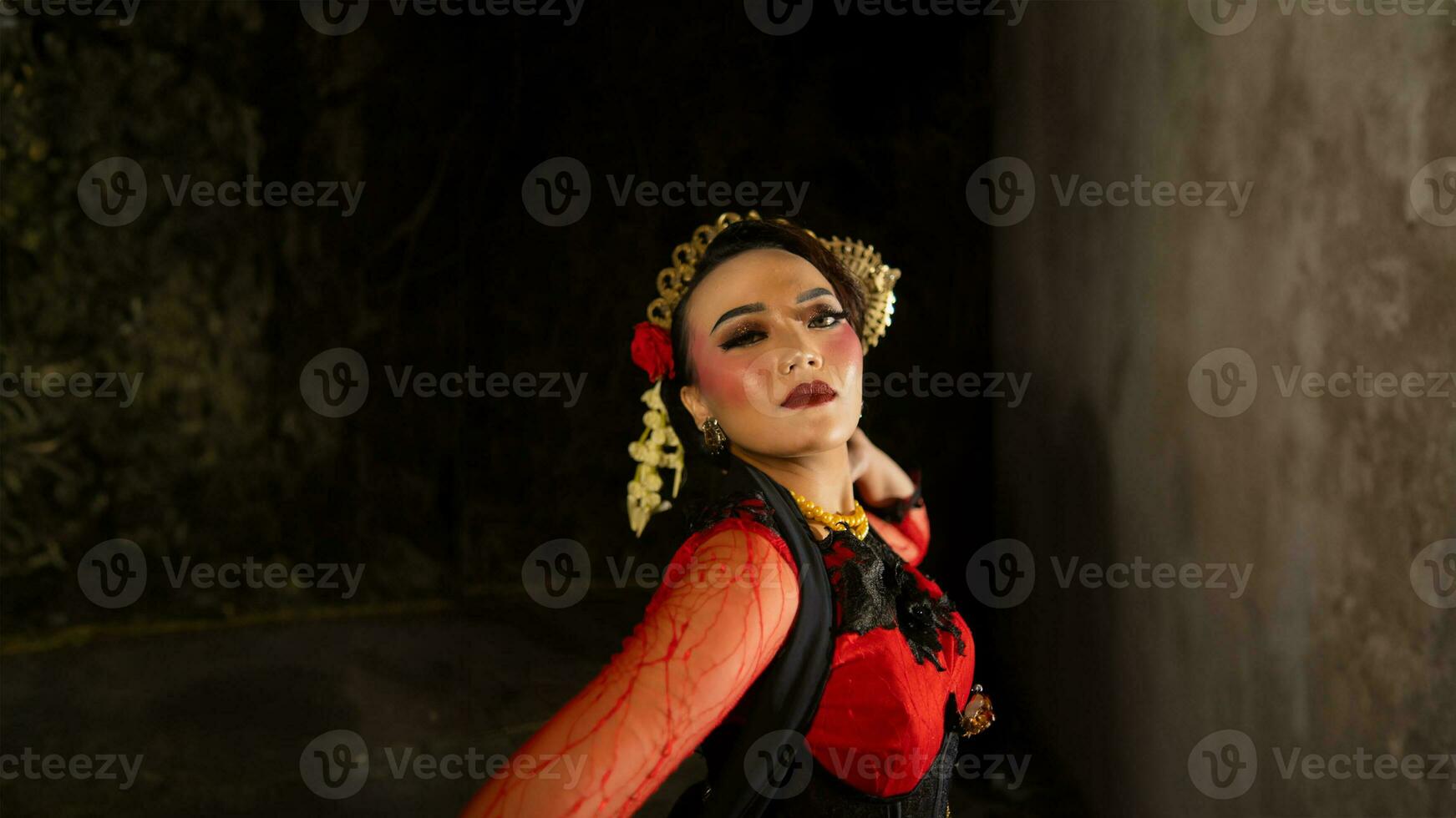 an Indonesian dancer shows a dance that shows the beauty of a tradition full of stories in every movement photo