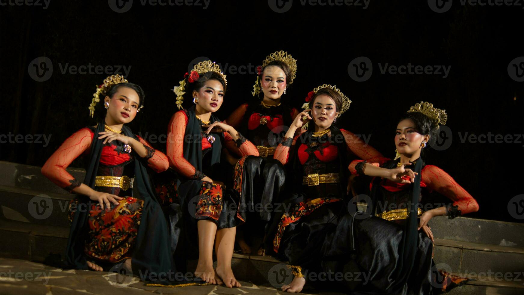 a group of dancers were seen relaxing with their friends and creating a warm atmosphere photo