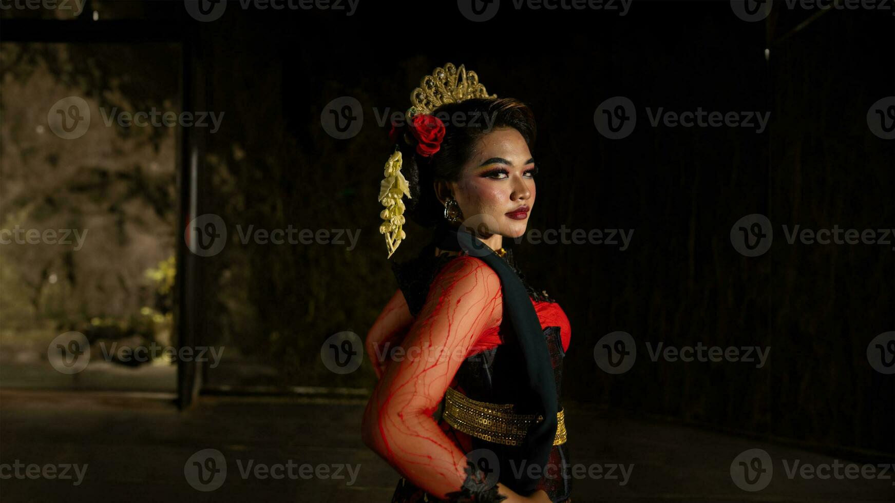 an Indonesian dancer with sparkling stage lights that create the impression of luxury and elegance photo