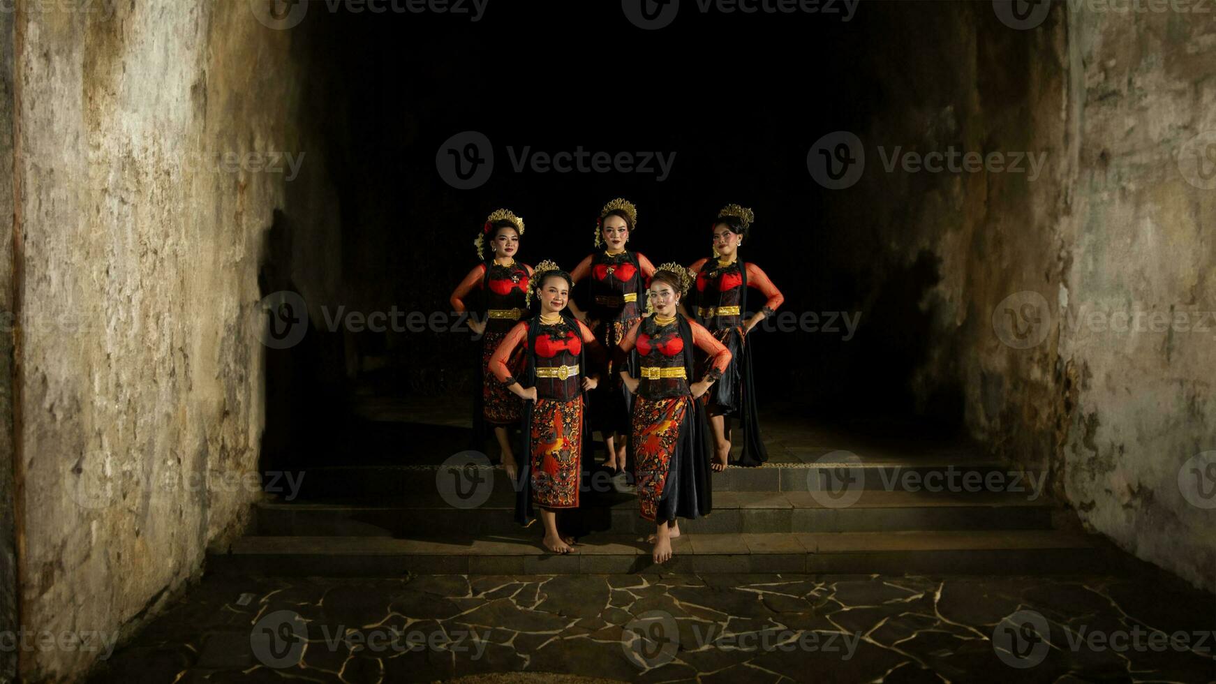 a group of dancers standing very proud and happy after finishing performing on stage photo