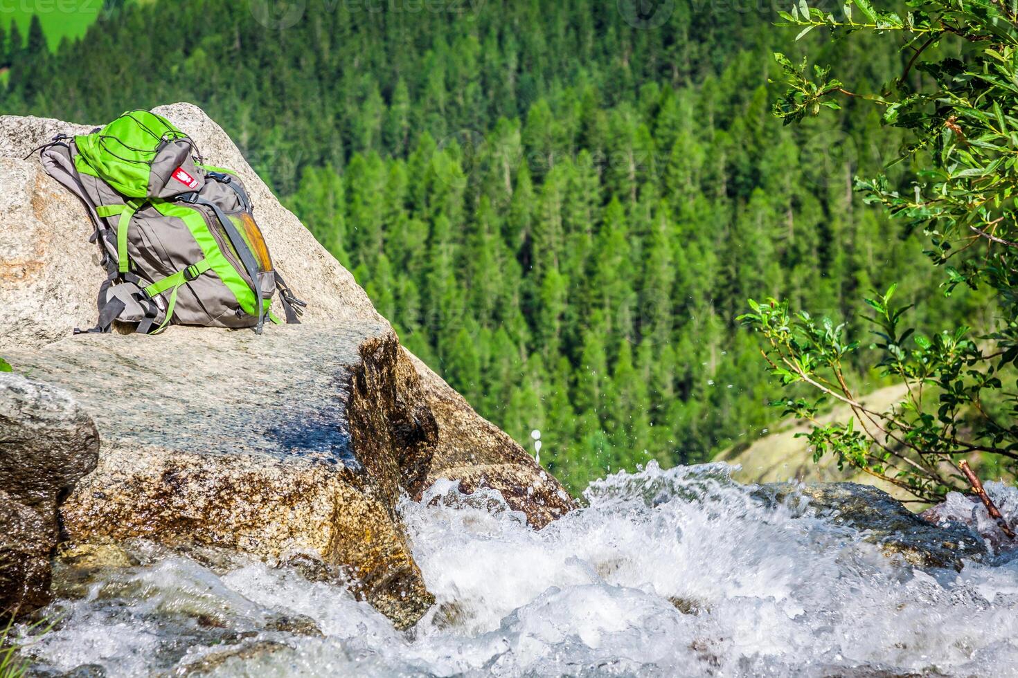 A stream trickling through rocks in the forest photo