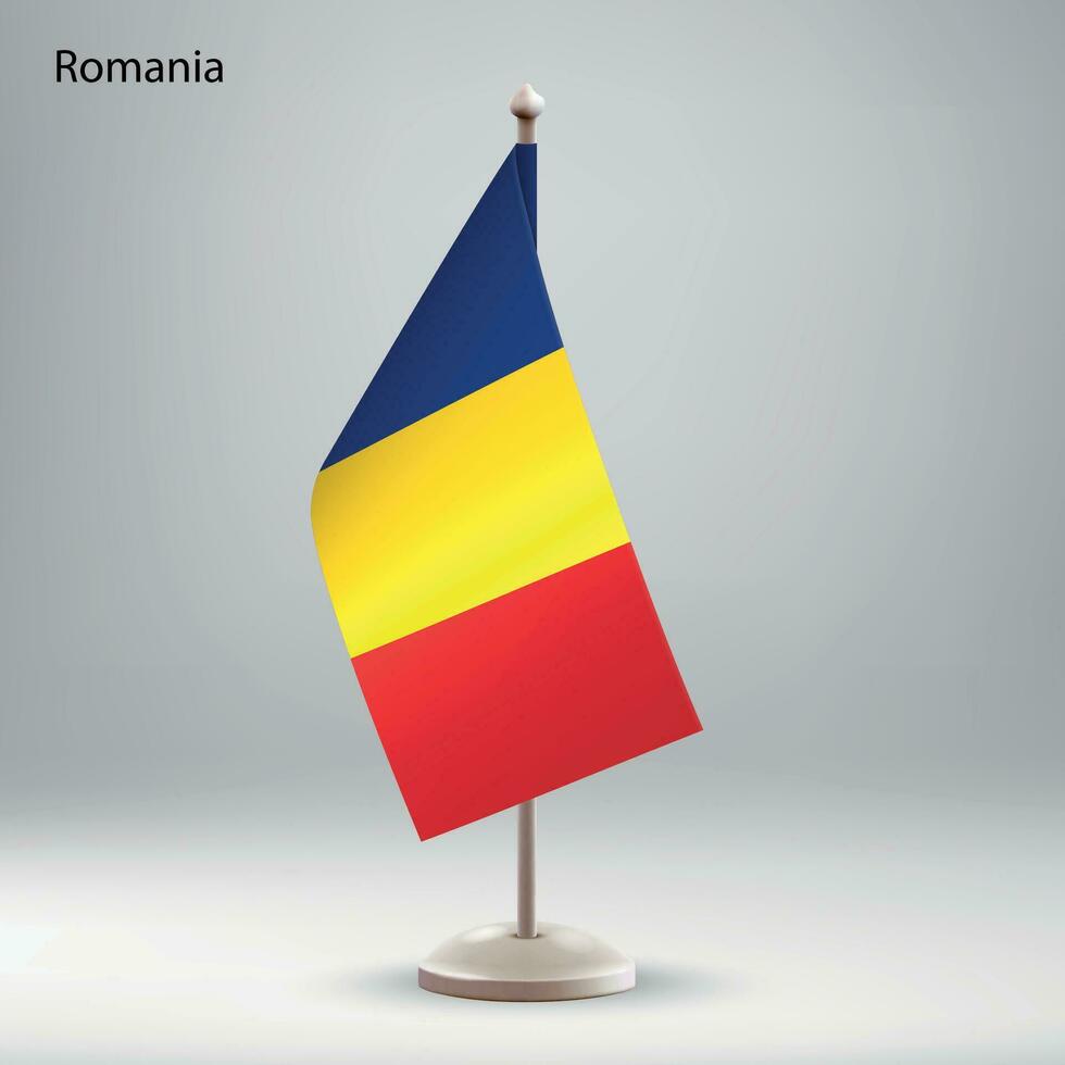 bandera de Rumania colgando en un bandera pararse. vector