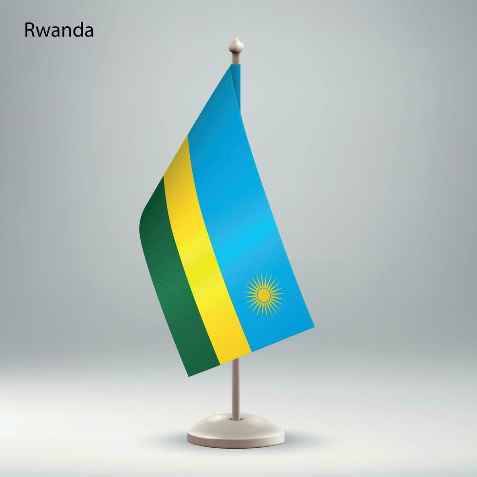 Flag of Rwanda hanging on a flag stand. vector