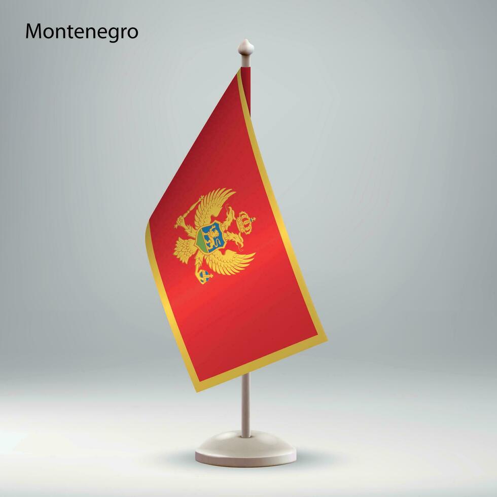 Flag of Montenegro hanging on a flag stand. vector