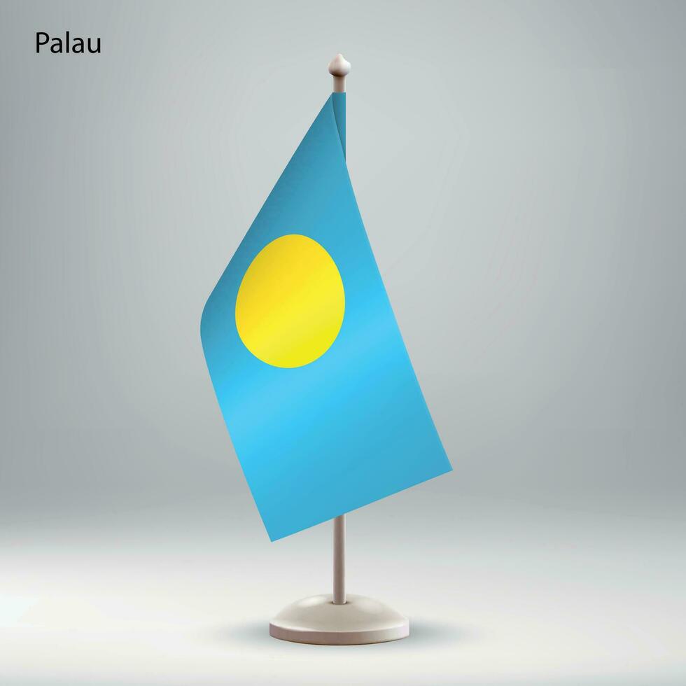Flag of Palau hanging on a flag stand. vector