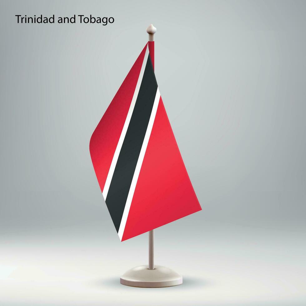 Flag of Trinidad and Tobago hanging on a flag stand. vector