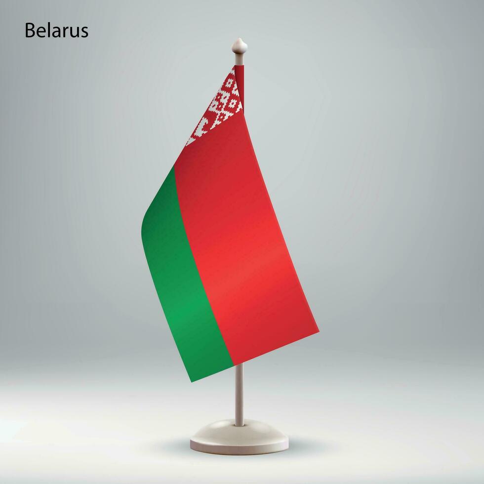 Flag of Belarus hanging on a flag stand. vector