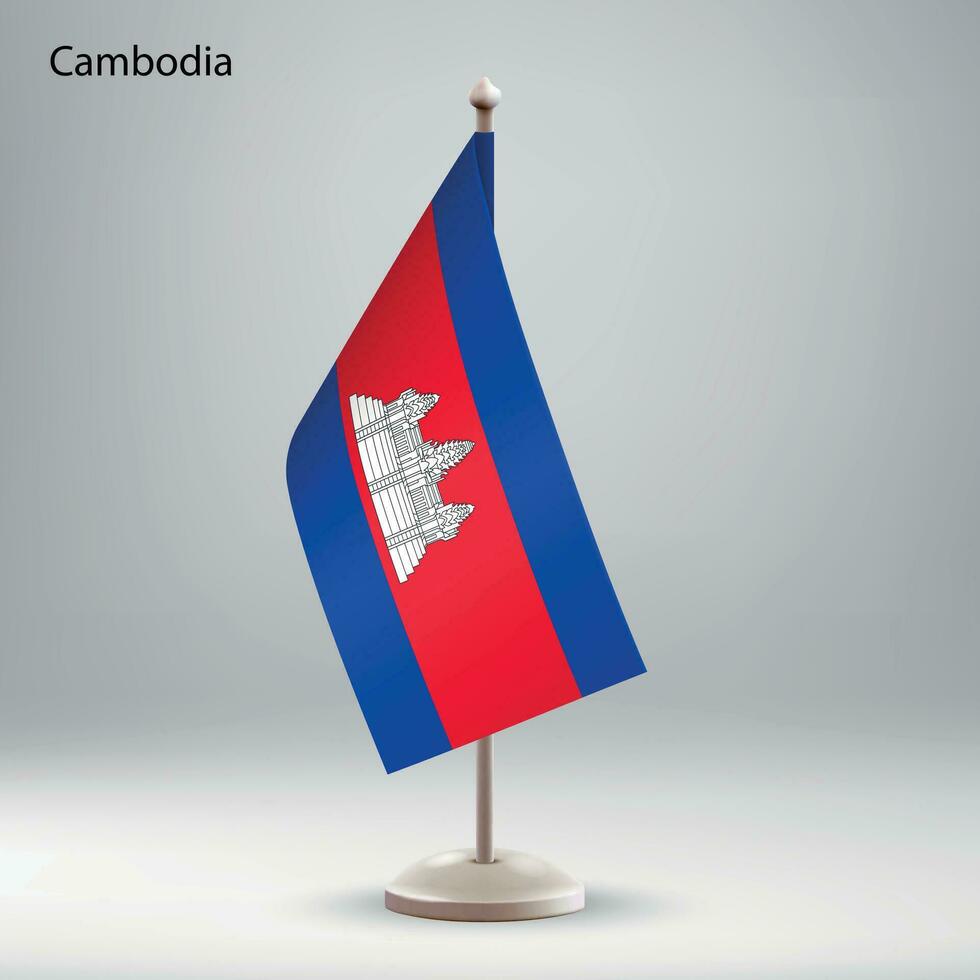 Flag of Cambodia hanging on a flag stand. vector