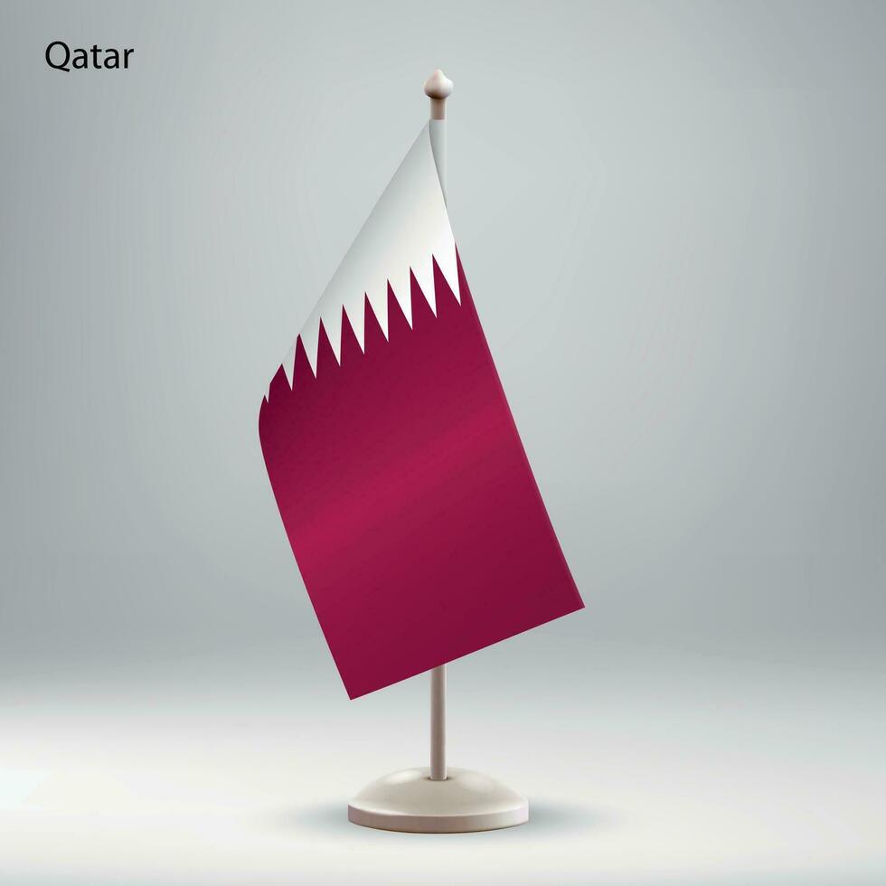 Flag of Qatar hanging on a flag stand. vector