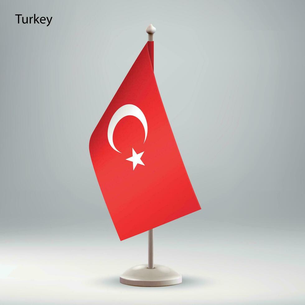 Flag of Turkey hanging on a flag stand. vector