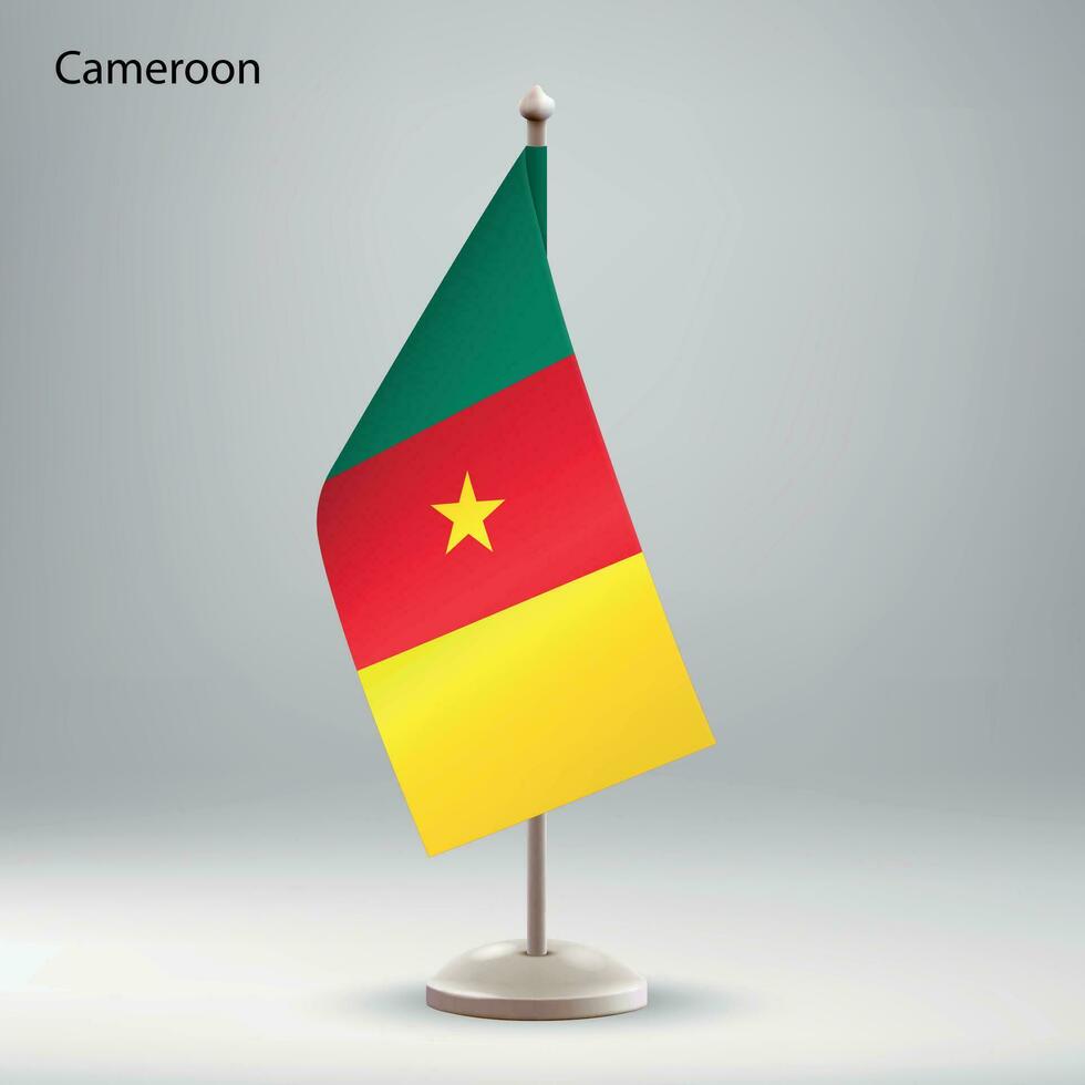 Flag of Cameroon hanging on a flag stand. vector