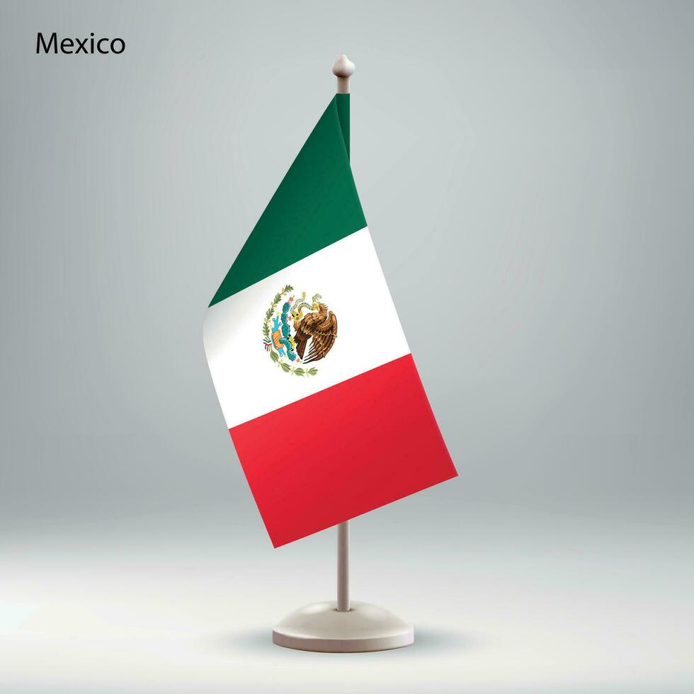 Flag of Mexico hanging on a flag stand. vector