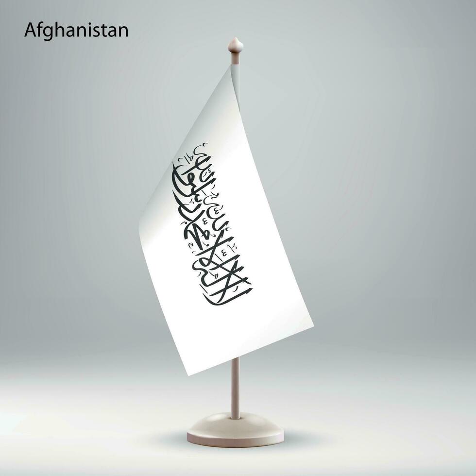 Flag of Afghanistan hanging on a flag stand. vector