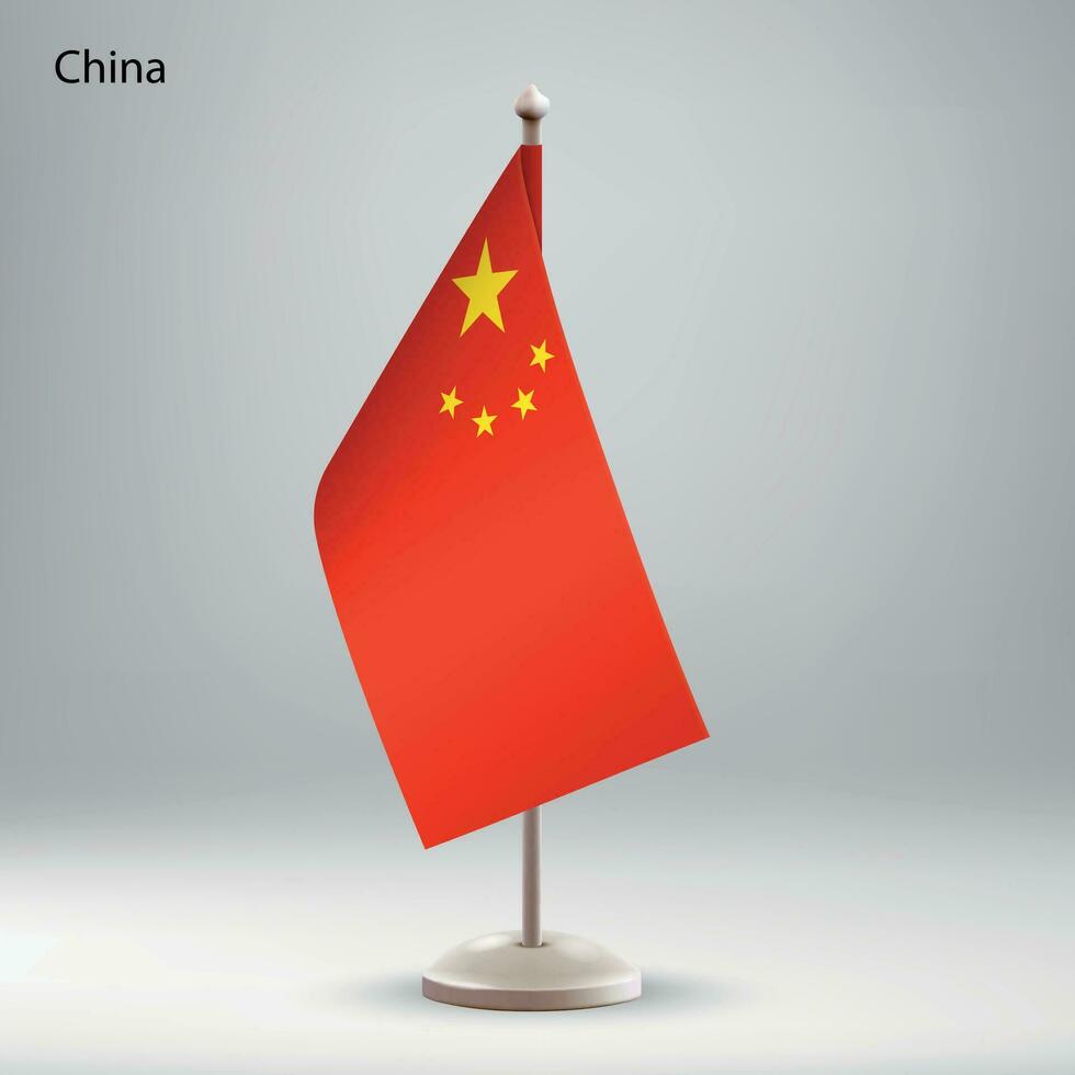 Flag of China hanging on a flag stand. vector