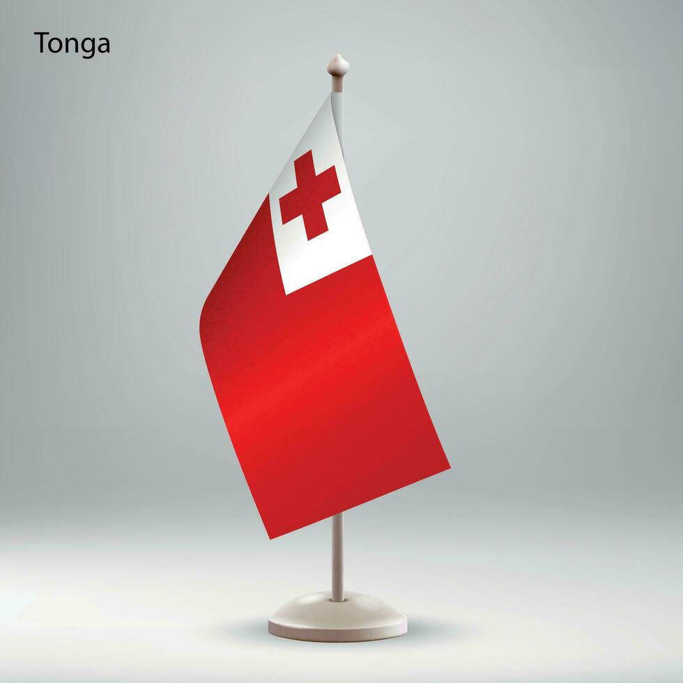 Flag of Tonga hanging on a flag stand. vector