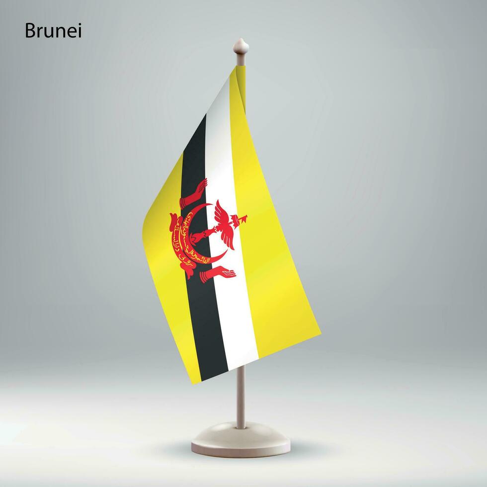 Flag of Brunei hanging on a flag stand. vector