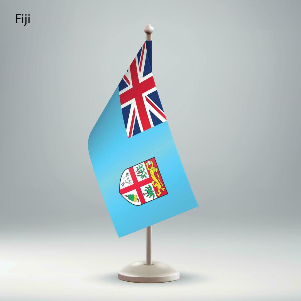 Flag of Fiji hanging on a flag stand. vector