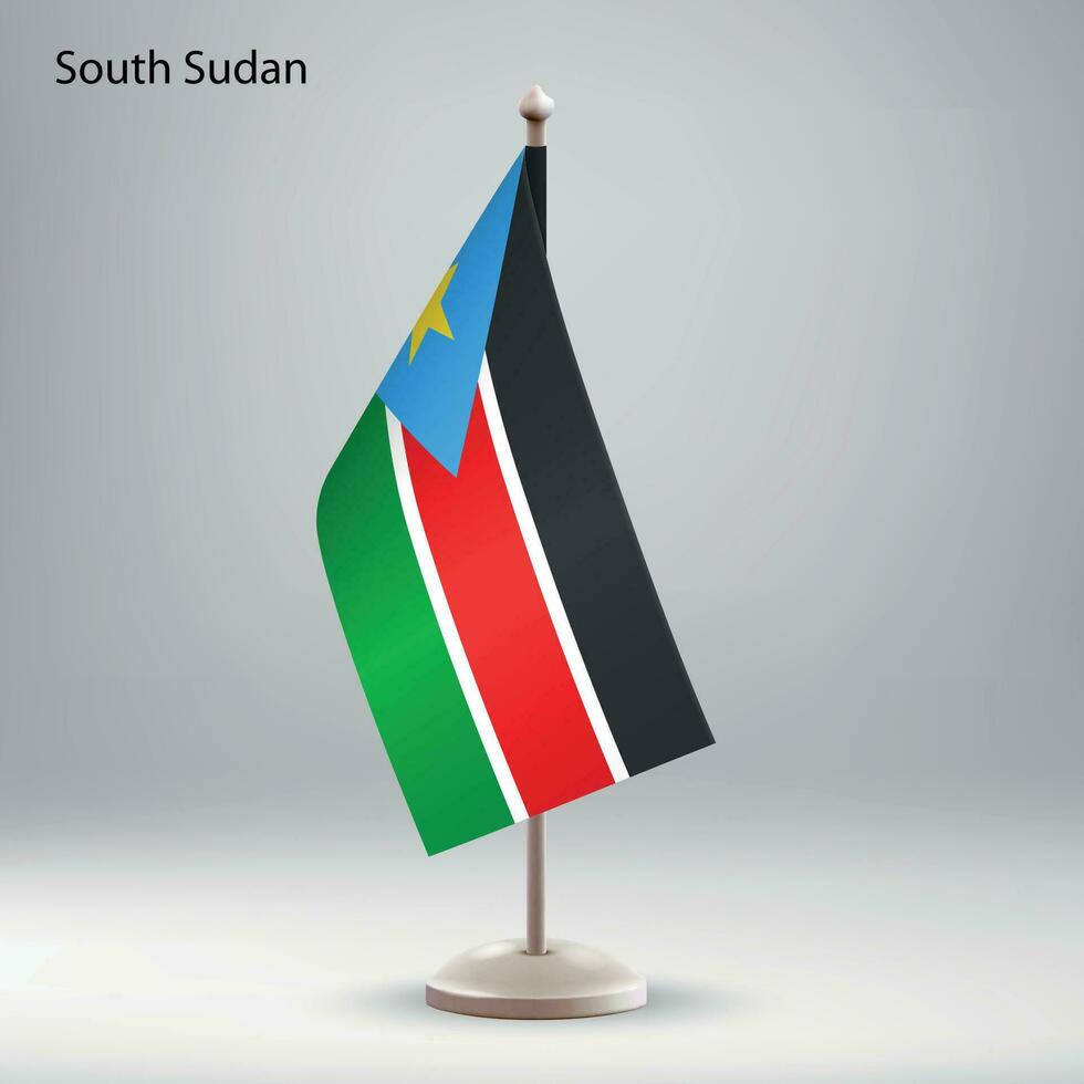 Flag of South Sudan hanging on a flag stand. vector