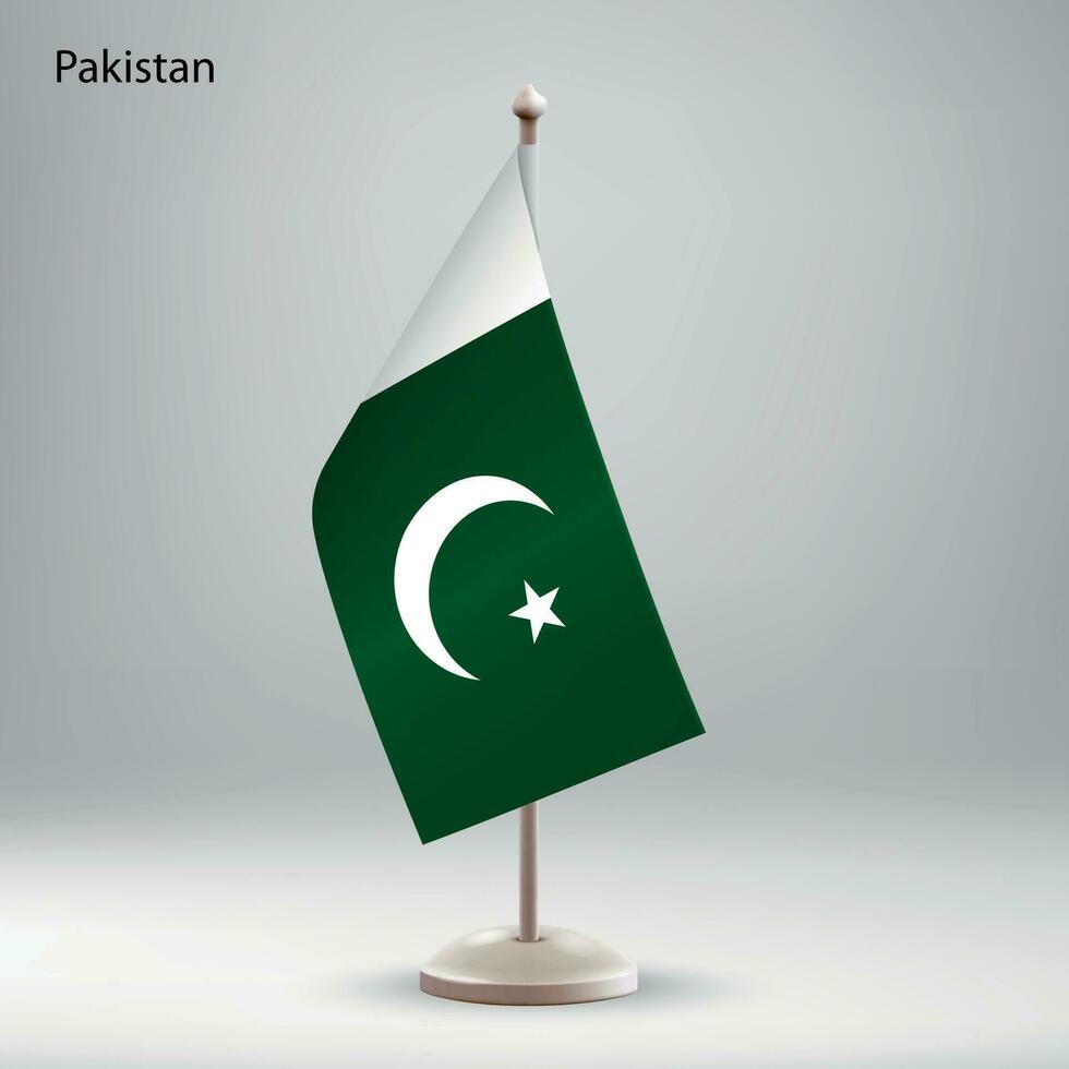 bandera de Pakistán colgando en un bandera pararse. vector