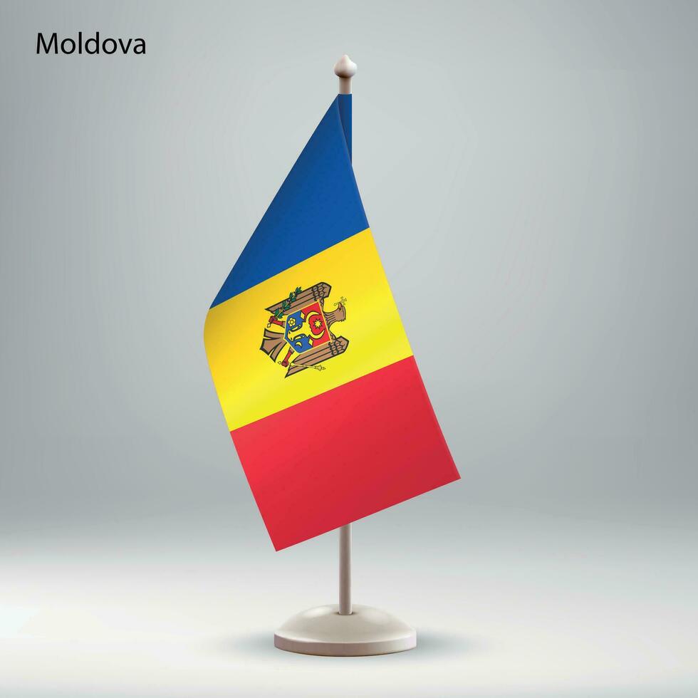 Flag of Moldova hanging on a flag stand. vector