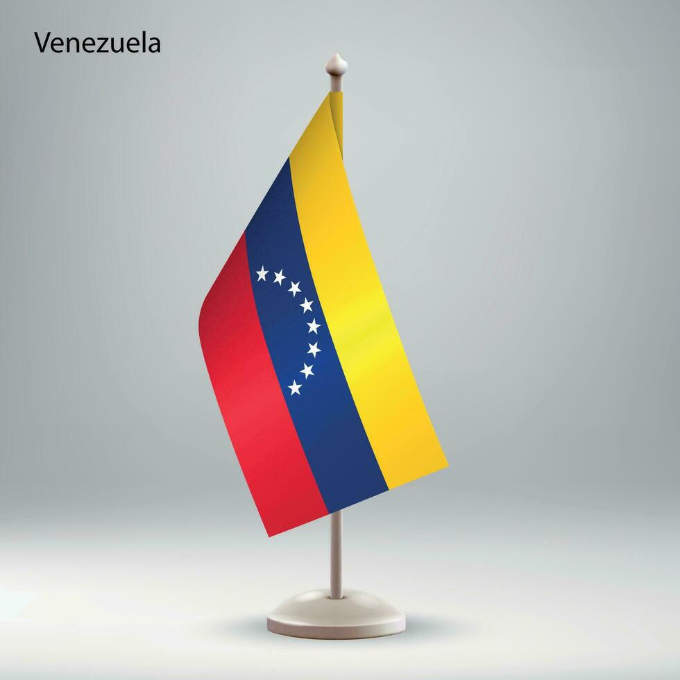 bandera de Venezuela colgando en un bandera pararse. vector