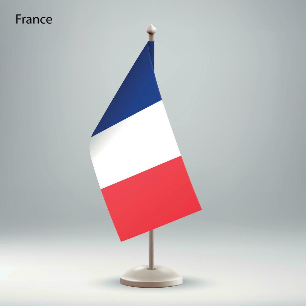 Flag of France hanging on a flag stand. vector